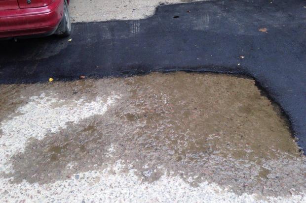Вода вже незабаром може знищити нове покриття на вулиці Біласа і Данилишина